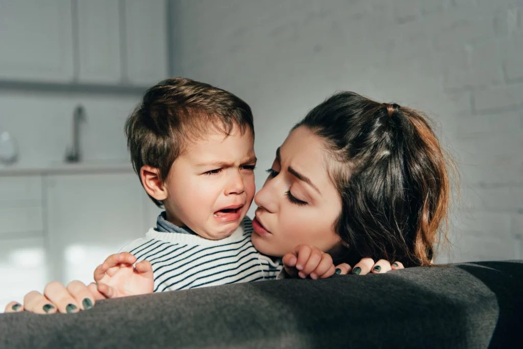 mom soothing her crying toddler