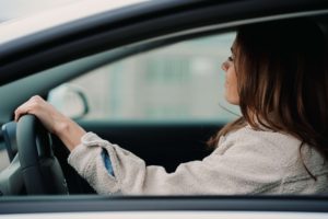 woman driving in car